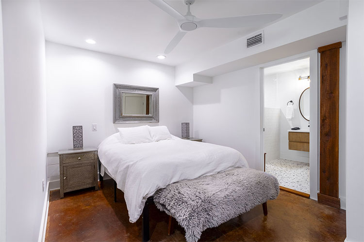 Luxury bedroom with ensuite bathroom at Group Retreat in Fairhope, Alabama