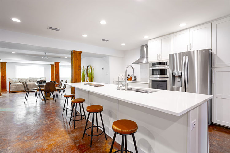 Cook's kitchen and island at Group Retreat in Fairhope, Alabama